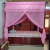 light pink mosquito net for bed in a bedroom