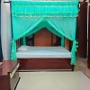bright aqua mosquito net for bed in a bedroom