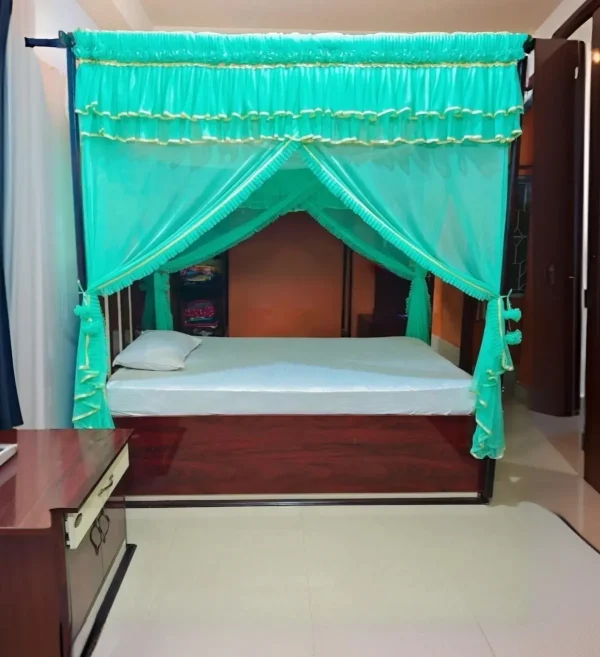 bright aqua mosquito net for bed in a bedroom
