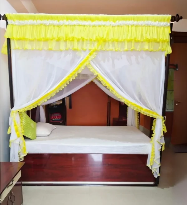 light yellow mosquito net for bed in a bedroom