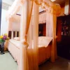peach designer curtain style mosquito net in a room