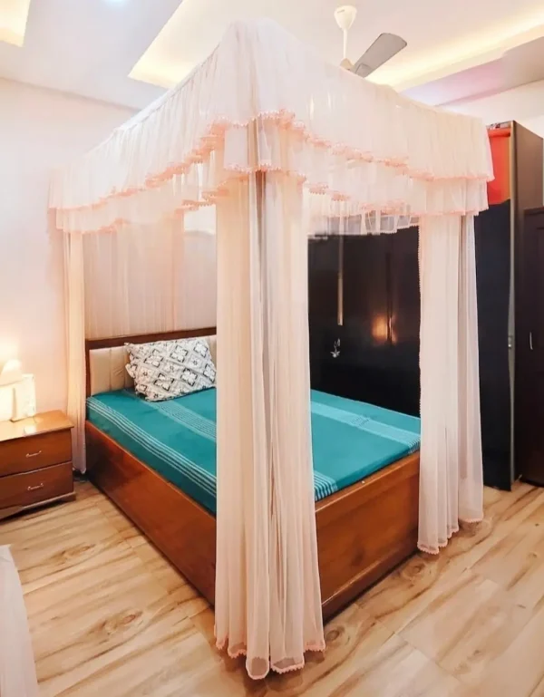 peach color curtain style mosquito net in a bedrom